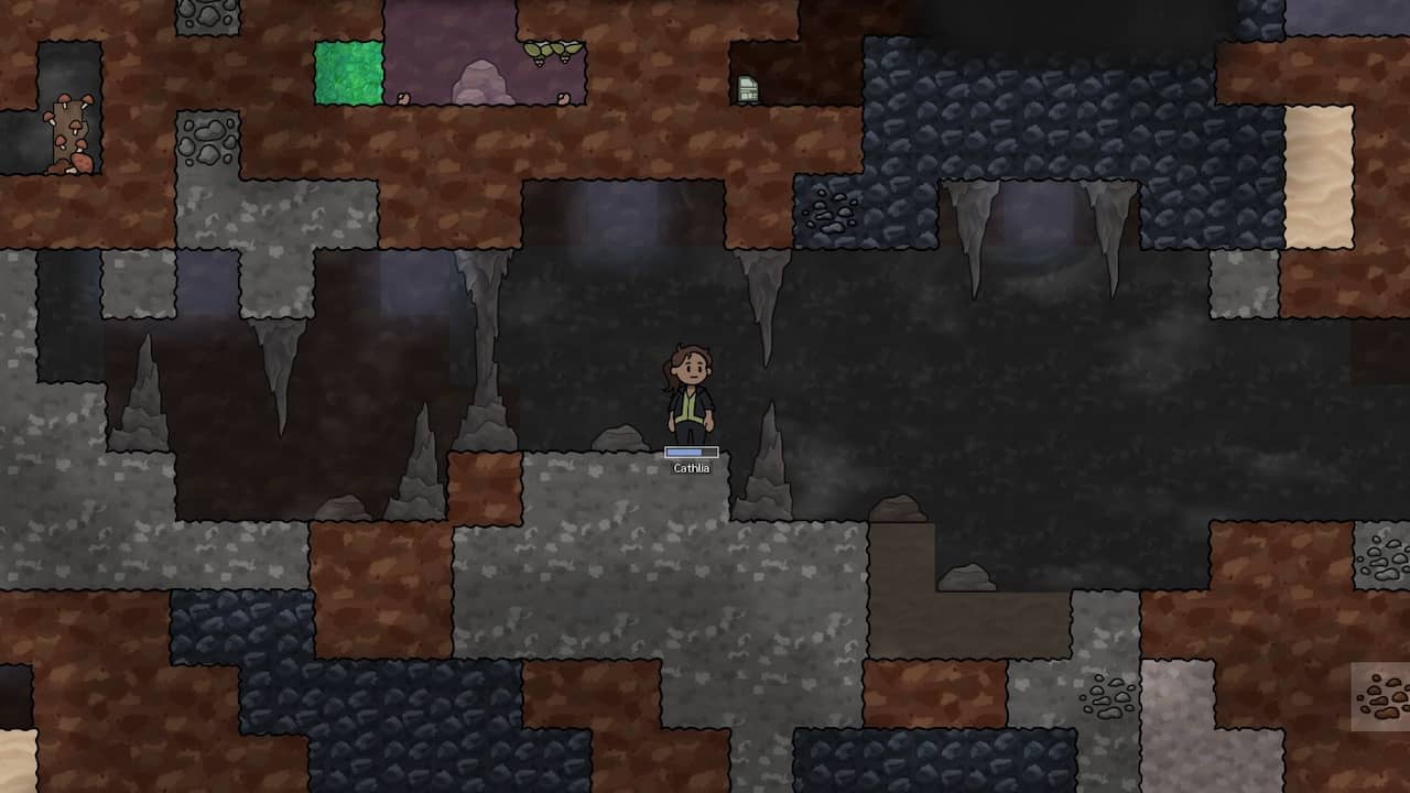 In-game screenshot showing stalactites and stalagmites in procedurally-generated cave terrain.